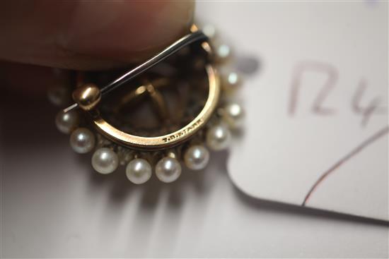 A late 19th/early 20th century American Theodore. B. Starr gold, cultured pearl and diamond set circular pendant brooch, 24mm.